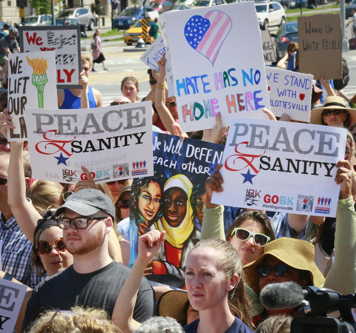 Protesters listen during a "Peace and Sanity" rally Sunday Aug. 13, 2017, in the Brooklyn borough of New York. during a rally about white supremacy violence in Charlottesville, Va. (Bebeto Matthews / Associated Press)