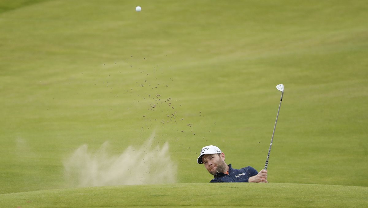 South Africa's Branden Grace plays out of a bunker on the 2nd hole during a practice round for the British Open Golf Championship at Royal St George's golf course Sandwich, England, Wednesday, July 14, 2021. The Open starts Thursday, July, 15.  (Peter Morrison)
