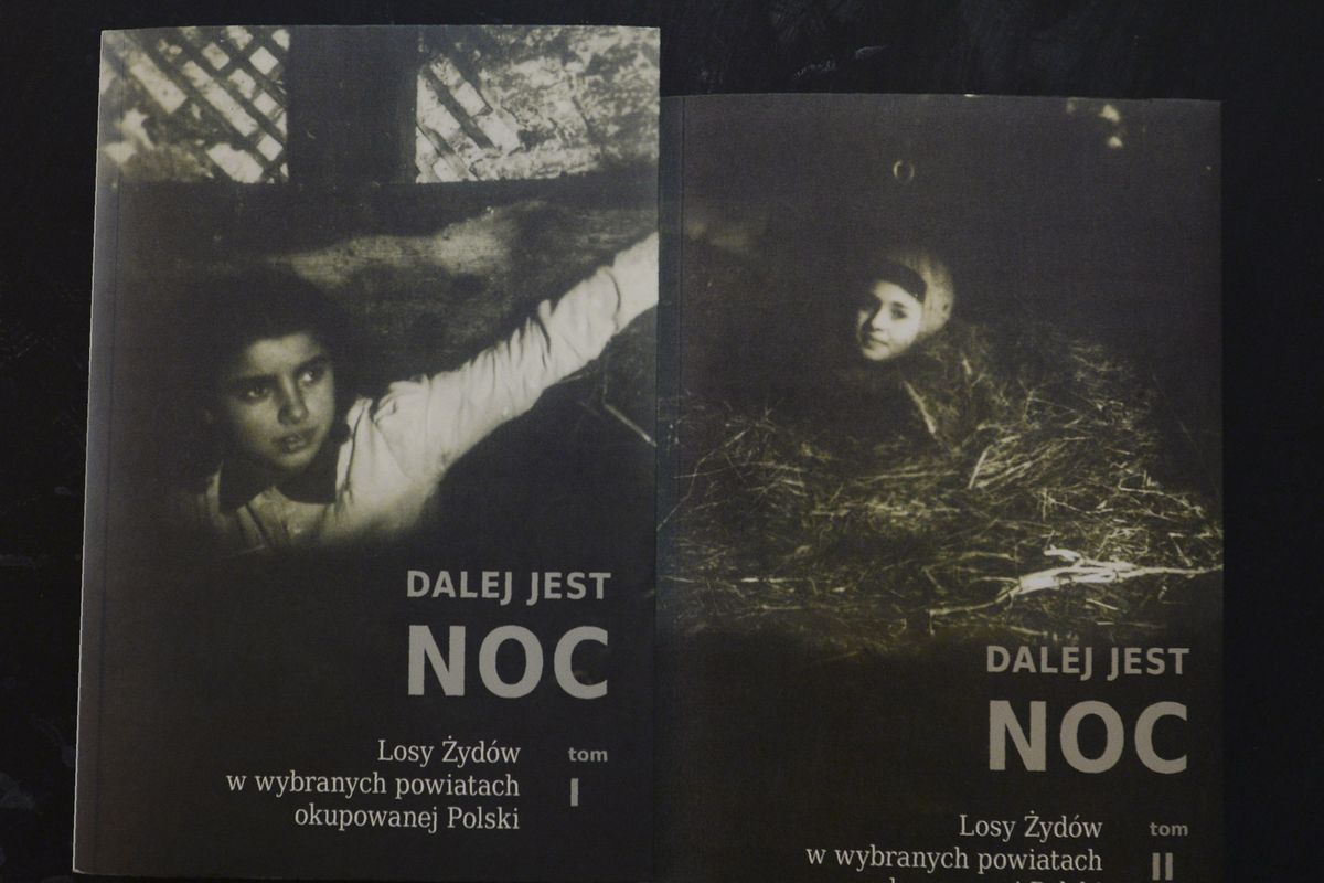 Copies of "Night Without End: The Fate of Jews in Selected Counties of Occupied Poland", are shown for sale in a bookstore at the Jewish Historical Institute in Warsaw, Poland, Tuesday Feb. 9, 2021. A court in Warsaw ruled Tuesday that the two-volume work