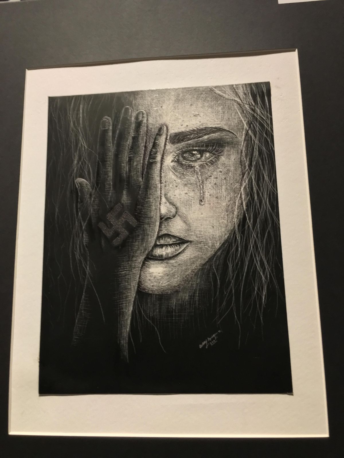 This piece by Aubrey Springer of Mead High School earned third place in the high school art portion of the Spokane Community Observance of the Holocaust 2018 Art and Essay Contests. Springer based the piece on a Gandhi quote, “Be the Change You Wish to See.” (Courtesy photo)