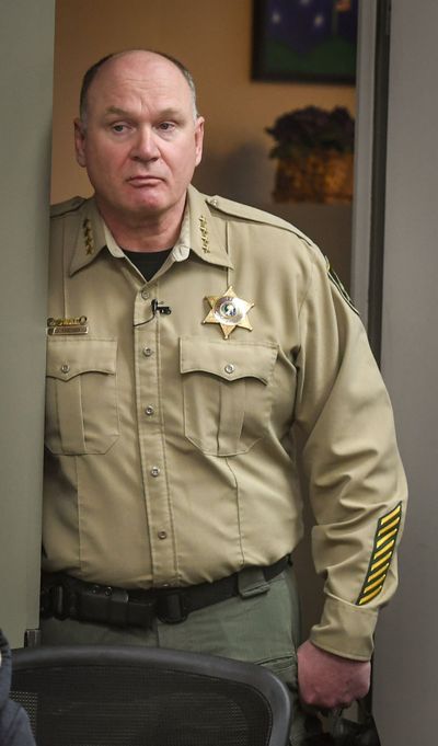 Spokane County Sheriff Ozzie Knezovich listens to Spokane County Prosecuting Attorney Larry Haskell during a news conference in February 2022.   (DAN PELLE/THE SPOKESMAN-REVIEW)