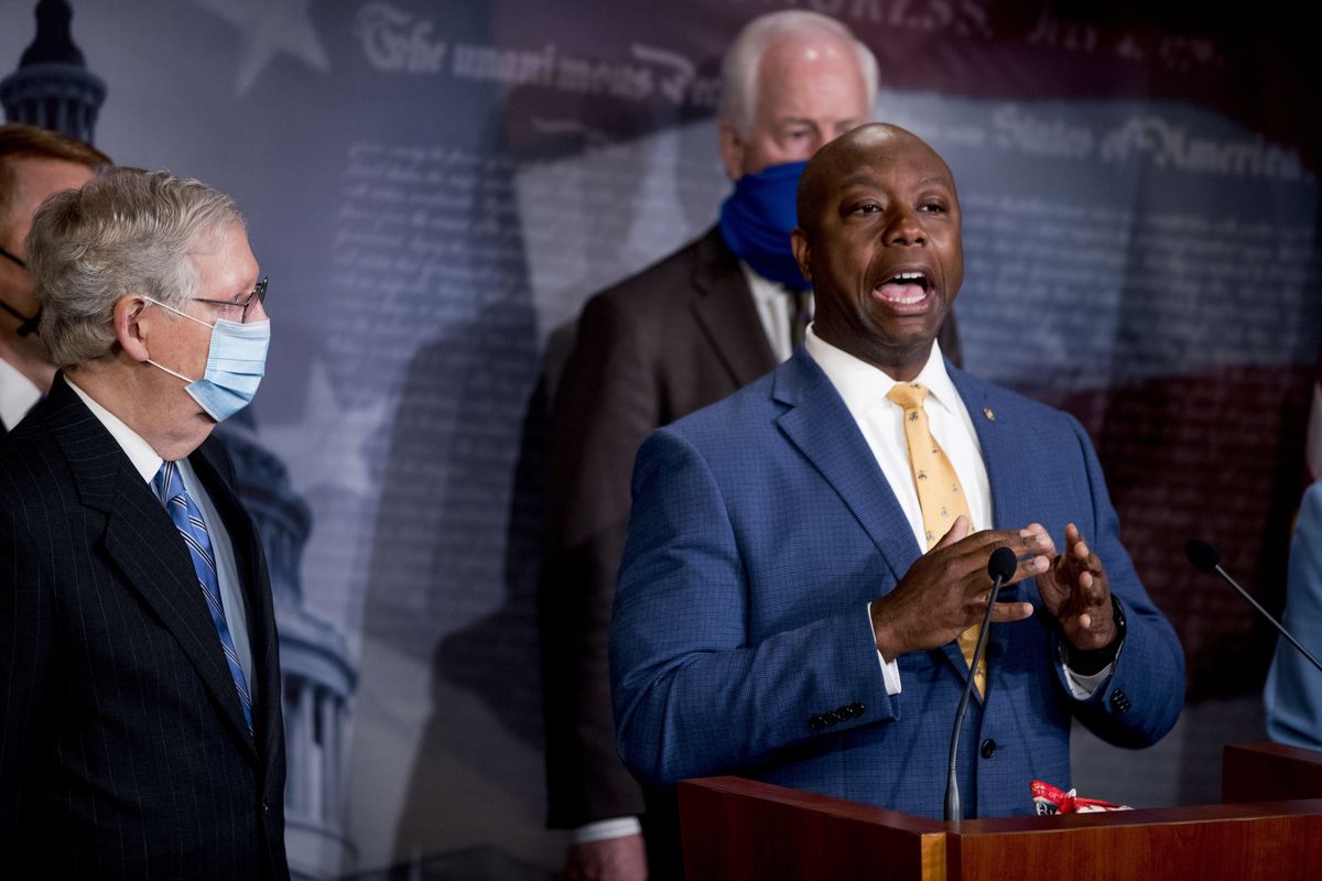 Sen. Tim Scott, R-S.C., right, accompanied by Senate Majority Leader Mitch McConnell of Ky., left, Sen. John Cornyn, R-Texas, center, and others, speaks at a news conference to announce a Republican police reform bill on Capitol Hill, Wednesday, June 17, 2020, in Washington.  (Andrew Harnik)