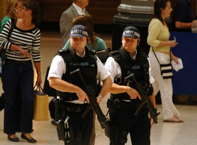 
Armed Metropolitan Police are deployed at Victoria station in London on Thursday. Thousands of police officers patrolled London's streets and sprawling subway system Thursday, four weeks after four suicide bombers killed 52 people on three subway trains and a bus. 
 (Associated Press / The Spokesman-Review)
