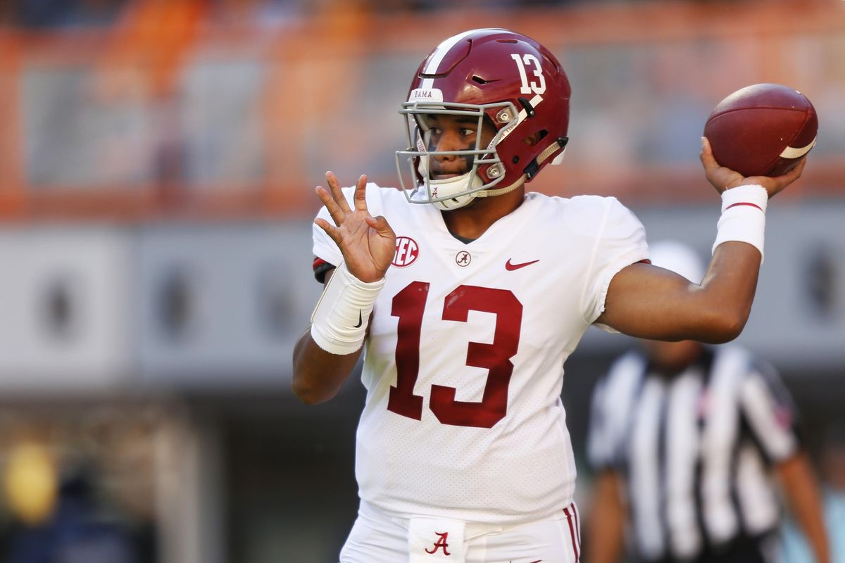 Alabama quarterback Tua Tagovailoa  throws to a receiver in the first half  against Tennessee on Saturday  in Knoxville, Tenn. (Wade Payne / AP)