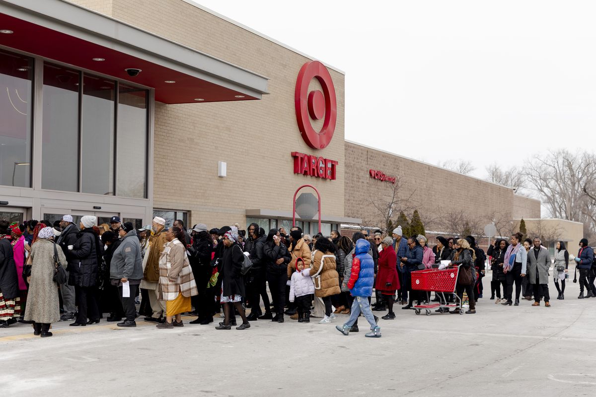 Church members gather outside the Target in Southfield.  (Sylvia Jarrus/For The Washington Post)