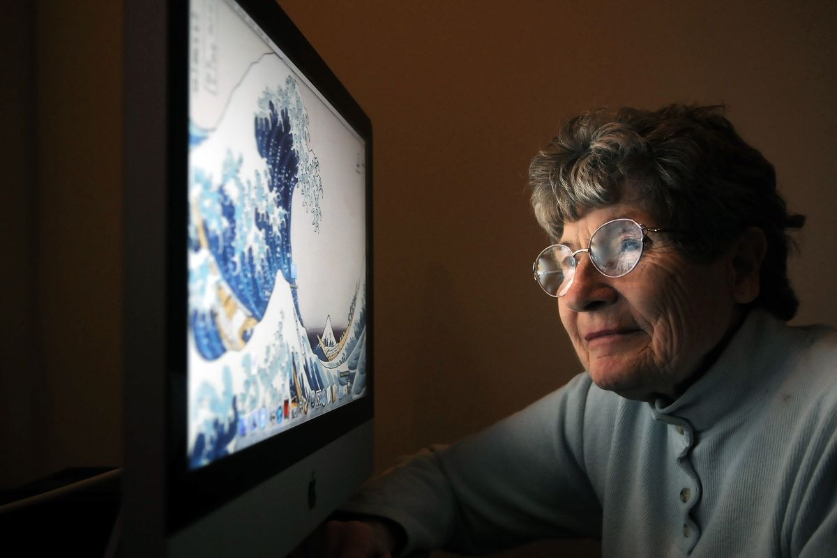 Florence Michaud, 77, of Spokane Valley, uses her Apple computer to exchange emails with family members or to keep up with friends. (Dan Pelle)