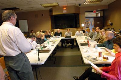 
In a noon meeting Wednesday, city Planning Director Dave Yadon, left, briefs the Planning Commission and Coeur d'Alene City Council. 
 (Jesse Tinsley / The Spokesman-Review)