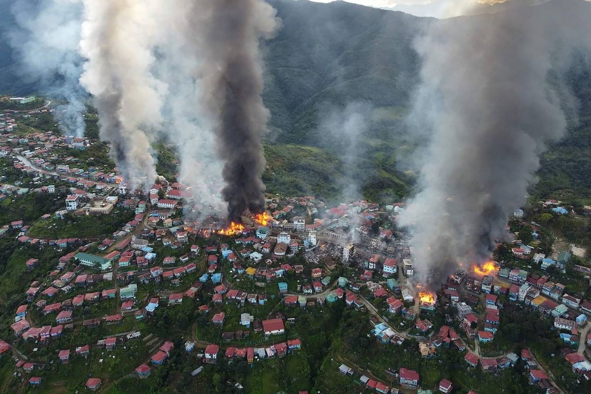 In this photo released by the Chin Human Rights Organization, fires burn in the town of Thantlang in Myanmar