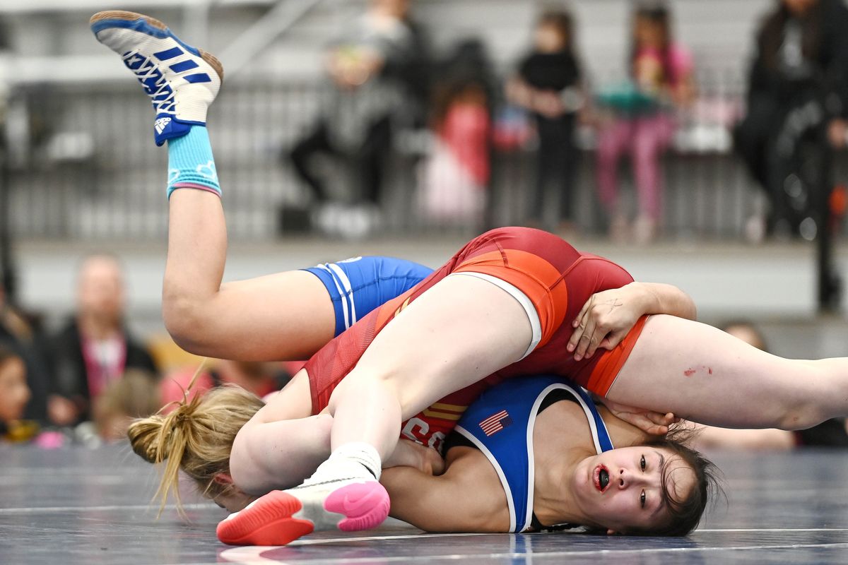 Emma Bacon, top, takes on Kayla Batres during the 2023 USA Wrestling Women’s National Championships held at the Podium on Sunday.  (JAMES SNOOK/FOR THE SPOKESMAN-REVIEW)
