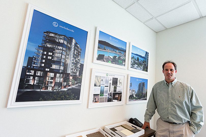 Kurt Lundblad, real estate agent for Century 21 Beutler and Associates, has created a series of renditions showing One Lakeside, a 14-story condominium project in downtown Coeur d���Alene. (Shawn Gust/press)