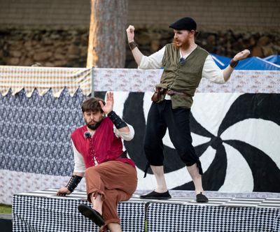 Preston Loomer, left, and David Hardie perform as the title characters in “Rosencrantz and Guildenstern Are Dead” in Manito Park Friday as part of the Spokane Shakespeare Society production. The same troupe of actors will also be alternating this Tom Stoppard play with the original “Hamlet” during multiple performances around Spokane in the coming days.  (Jesse Tinsley/THE SPOKESMAN-REVIEW)