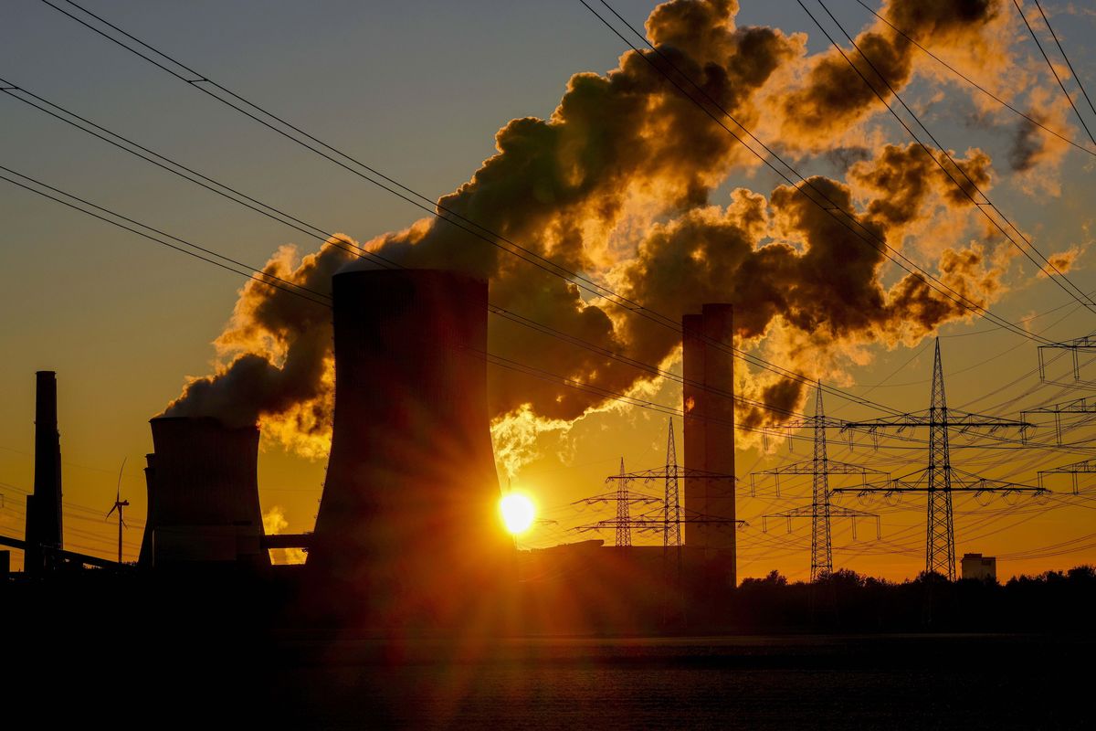 FILE - Steam comes out of the chimneys of the coal-fired power station in Niederaussem, Germany, Sunday, Oct. 24, 2021.  (Michael Probst)