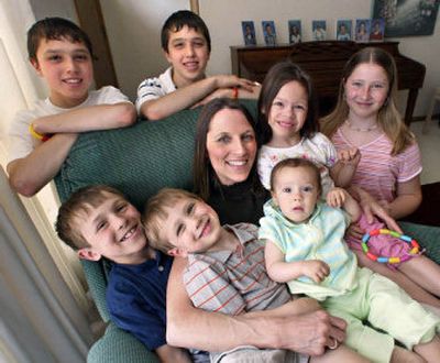 
Vickie Rohrbach, center, has her hands full as the mother of seven children. Surrounding her, clockwise from the top left are: David, 14, Michael, 14, Jessica, 6, Jordan, 11, Joy, 1, Andrew, 3 and Matthew, 9.
 (Knight Ridder / The Spokesman-Review)