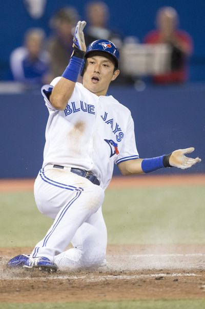 Toronto’s Munenori Kawasaki slides into home plate in the eighth to score the lone run Wednesday. (Associated Press)