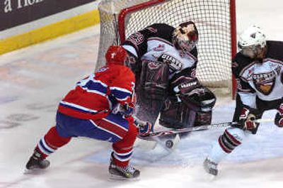 
Vancouver goaltender Tyson Sexsmith prevents Spokane's Trevor Glass from scoring in Friday's playoff game. Vancouver Sun
 (Steve Bosch Vancouver Sun / The Spokesman-Review)