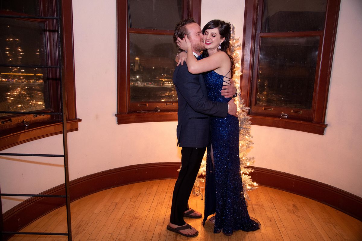 Travis Christensen and Kendra Buell hug after a marriage proposal in The Spokesman-Review clocktower on Monday, Dec. 30, 2019, in downtown Spokane. (Jesse Tinsley / The Spokesman-Review)