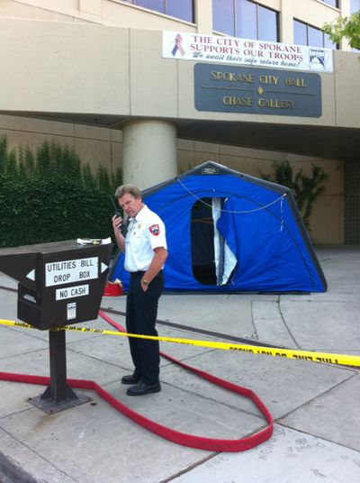 A hazardous materials tent was set up outside Spokane City Hall on Monday, Aug. 16, 2010, after an employee found a white powder. The building was closed to the public Monday afternoon. (Jonathan Brunt / The Spokesman-Review)