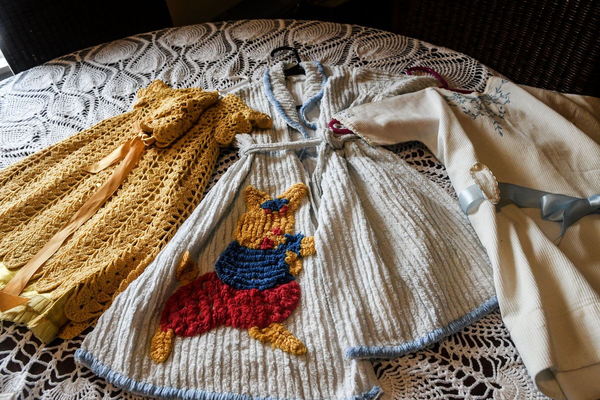 These vintage baby clothes are part of Adelia Rosman’s collection.  (Kathy Plonka/The Spokesman-Review)