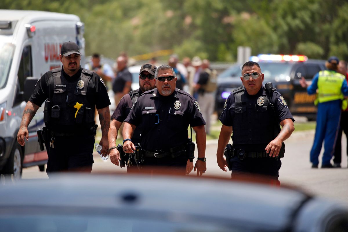 Police walk near Robb Elementary School following a shooting, Tuesday, May 24, 2022, in Uvalde, Texas. (AP Photo/Dario Lopez-Mills) ORG XMIT: TXDL104  (Dario Lopez-Mills)