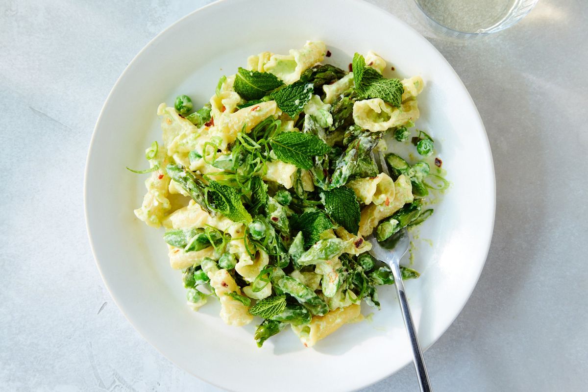 Yogurt and feta make this asparagus pasta light and springy, piquant and creamy. It can be served hot or warm, but also works well at room temperature.  (RYAN LIEBE/New York Times)