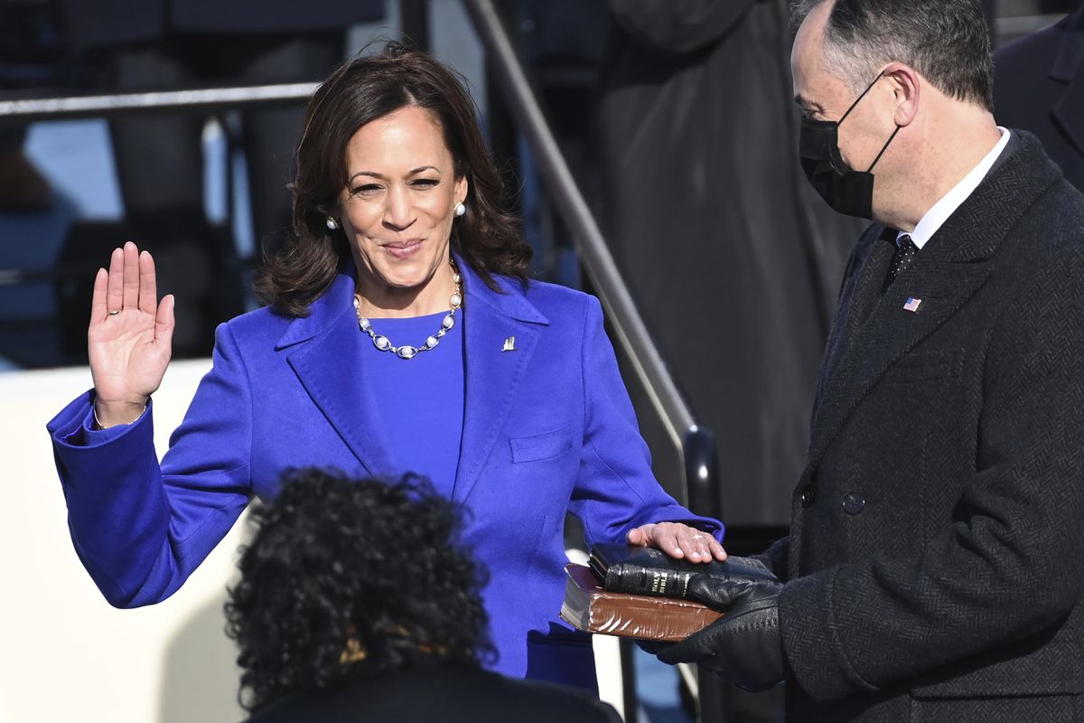 Kamala Harris is sworn in as vice president by Supreme Court Justice Sonia Sotomayor as her husband, Doug Emhoff, holds the Bible on Wednesday during the 59th Presidential Inauguration at the U.S. Capitol in Washington, D.C.  (Saul Loeb/Associated Press)