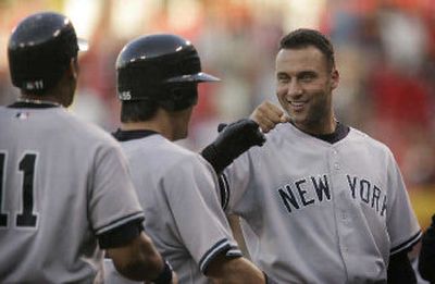 
Derek Jeter, right, and the New York Yankees got off to a fast start and beat the Los Angeles Angels 4-2 in Game 1. 
 (Associated Press / The Spokesman-Review)