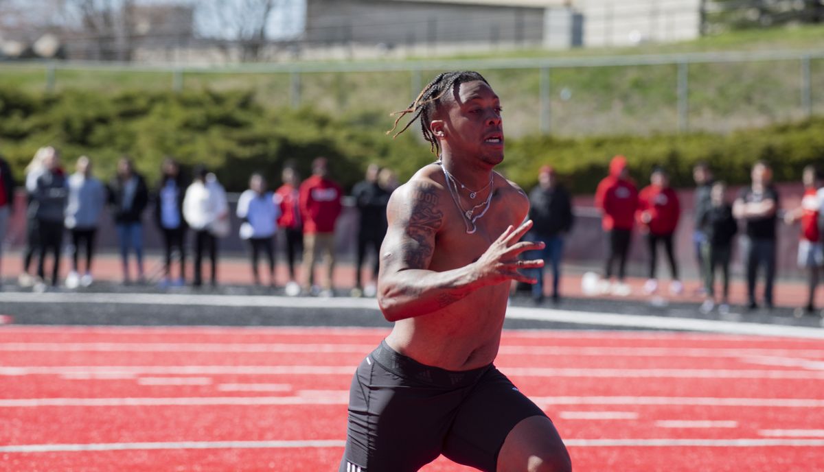 EWU Eagles quarterback Eric Barriere runs a 40-yard dash on the field, surrounded by friends and family, for pro nfootball scouts on Wednesday, April 6, 2022, which was Pro Day at Eastern.  (Jesse Tinsley/The Spokesman-Review)