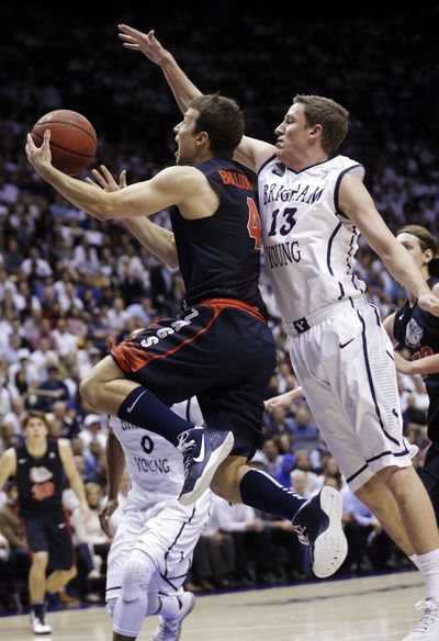 Gonzaga’s Kevin Pangos goes to the basket as Brigham Young’s Brock Zylstra defends. (Associated Press)