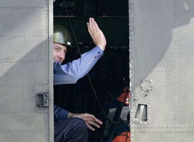 
Leading Seaman Chris Coe, one of  15 British service personnel released by Iran, waves from a military helicopter at London's Heathrow Airport on Thursday  after  arriving back in the United Kingdom.
 (Associated Press / The Spokesman-Review)