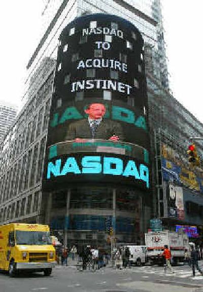 
The image of Ed Nicoll, CEO of Instinet, appears on the electronic display of the NASDAQ marketsite in New York's Times Square on Friday. 
 (Associated Press / The Spokesman-Review)