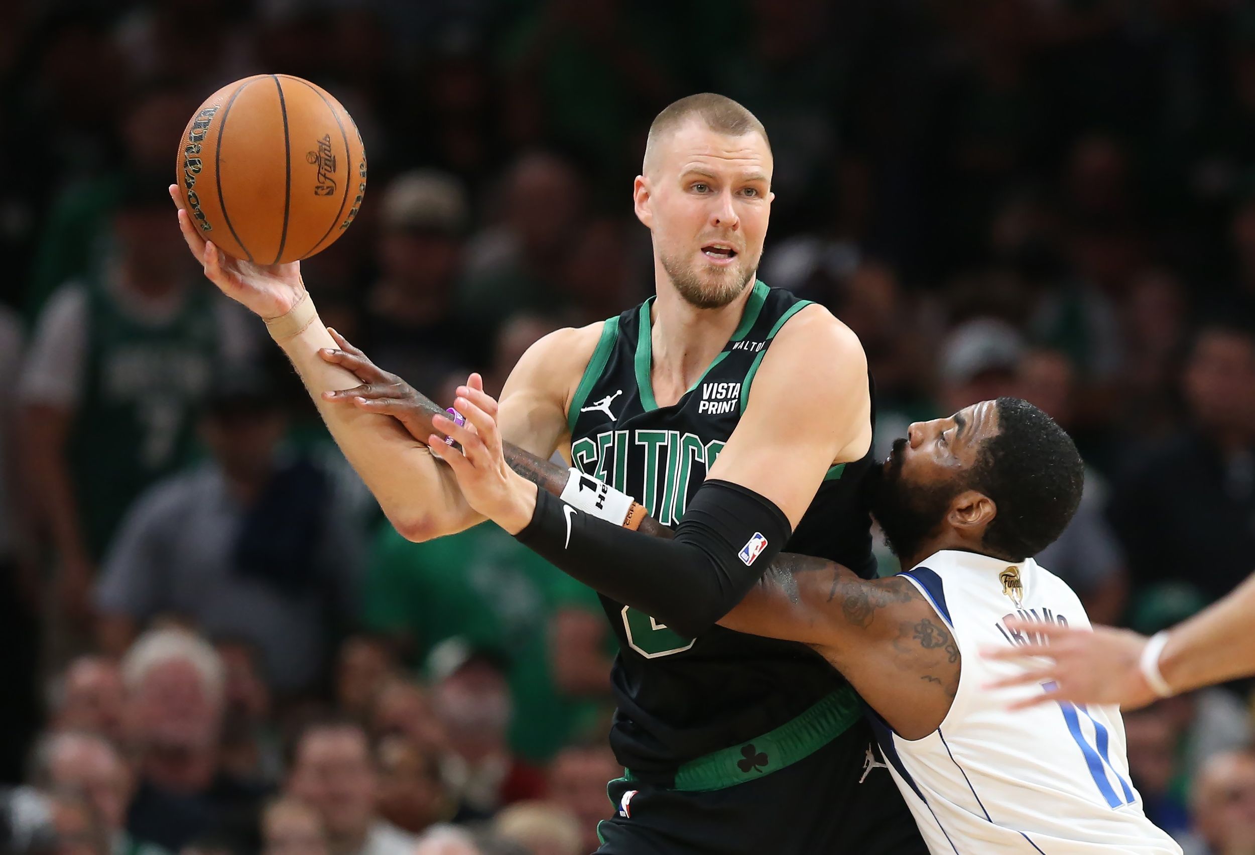 Celtics’ Kristaps Porziņģis tears tendon in leg, Game 3 status unclear ...