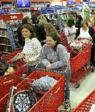 
More retailers opened at midnight on the day after Thanksgiving.
 (Associated Press / The Spokesman-Review)