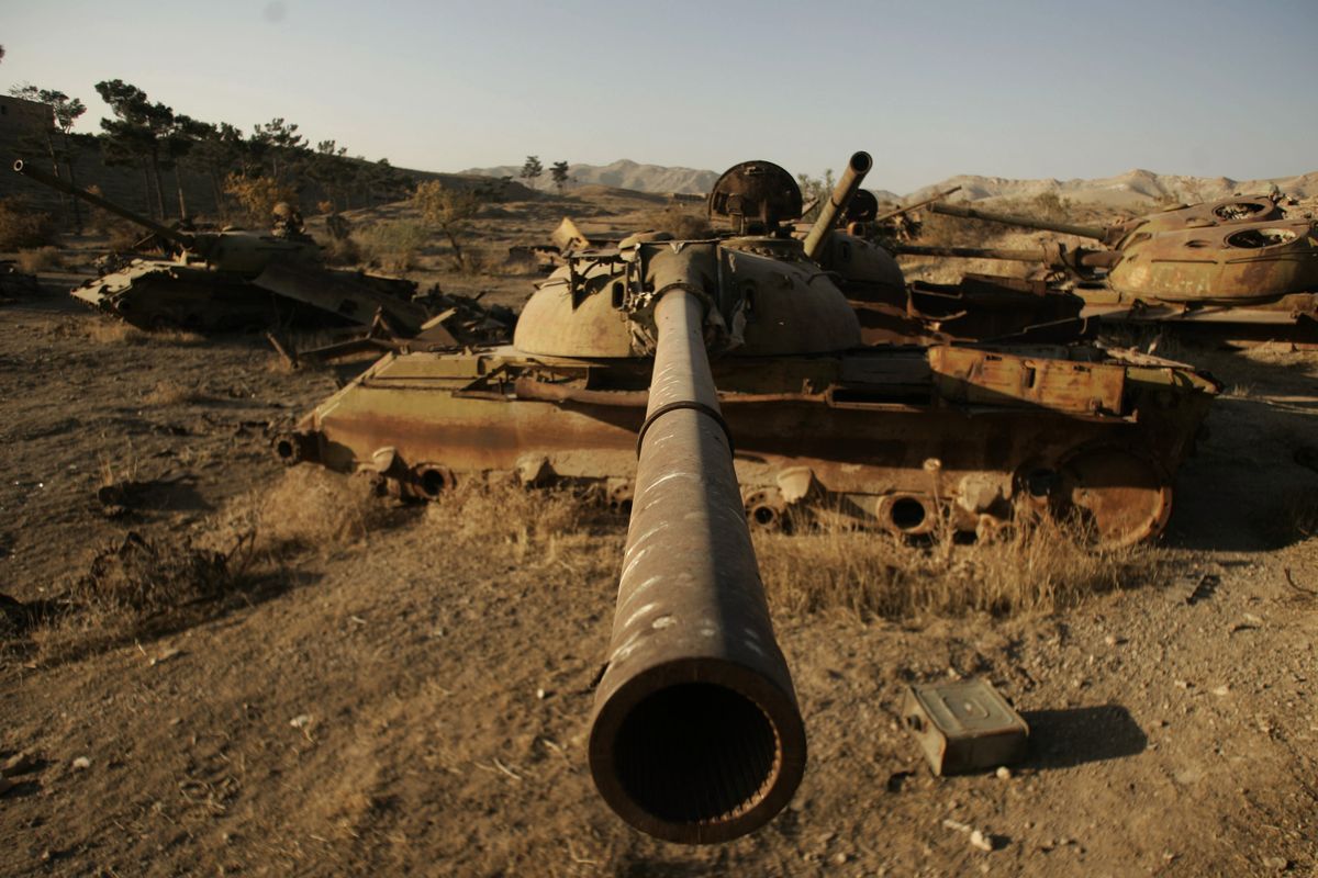 Destroyed Soviet tanks sit outside Herat, west of Kabul, Afghanistan, on Thursday. The U.S.-led coalition has now been fighting for as long as the Soviets did in Afghanistan. (Associated Press)