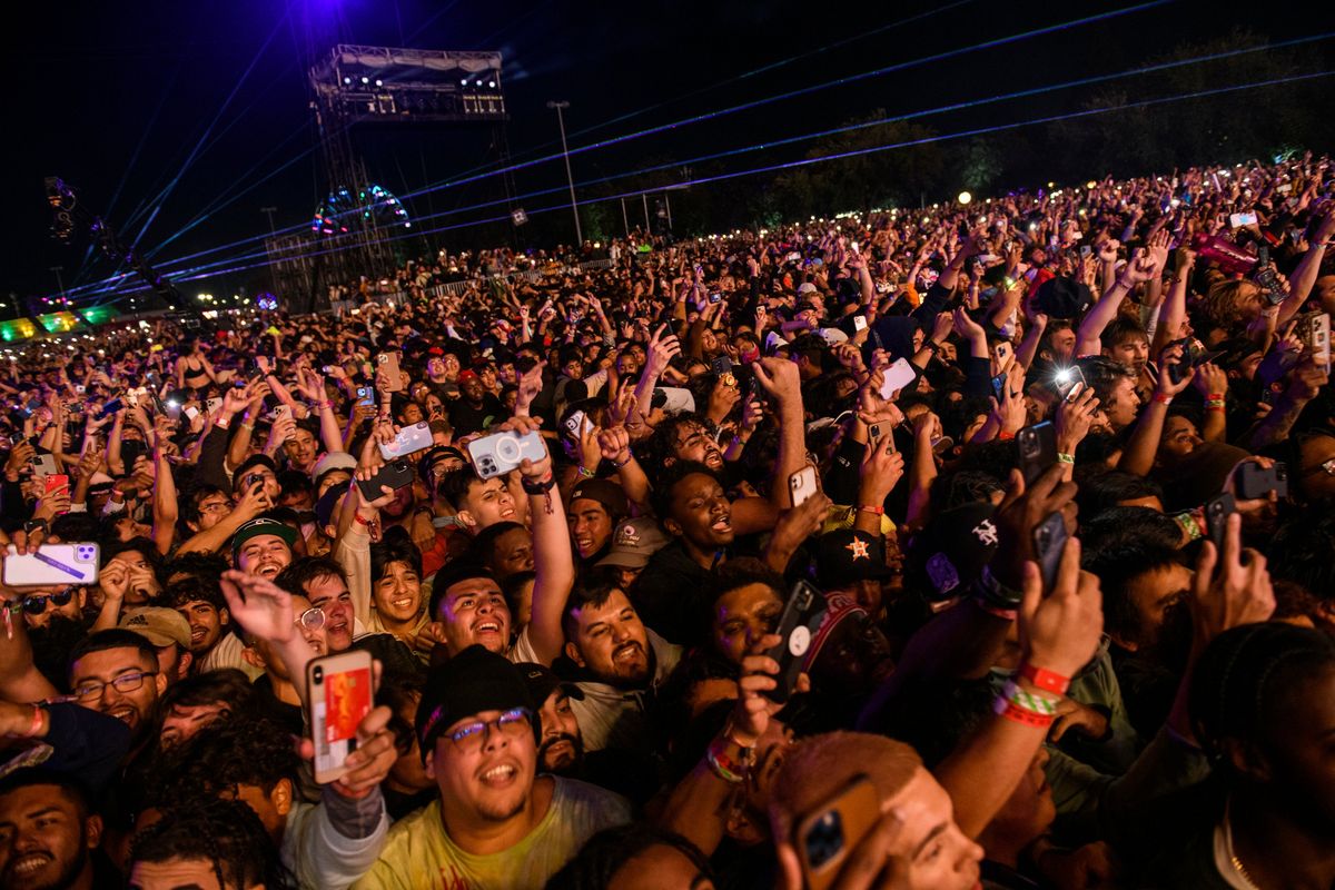 The crowd watches as Travis Scott performs at Astroworld Festival at NRG park on Friday, Nov. 5, 2021 in Houston. Several people died and numerous others were injured in what officials described as a surge of the crowd at the music festival while Scott was performing. Officials declared a “mass casualty incident” just after 9 p.m. Friday during the festival where an estimated 50,000 people were in attendance, Houston Fire Chief Samuel Peña told reporters at a news conference.  (Jamaal Ellis)