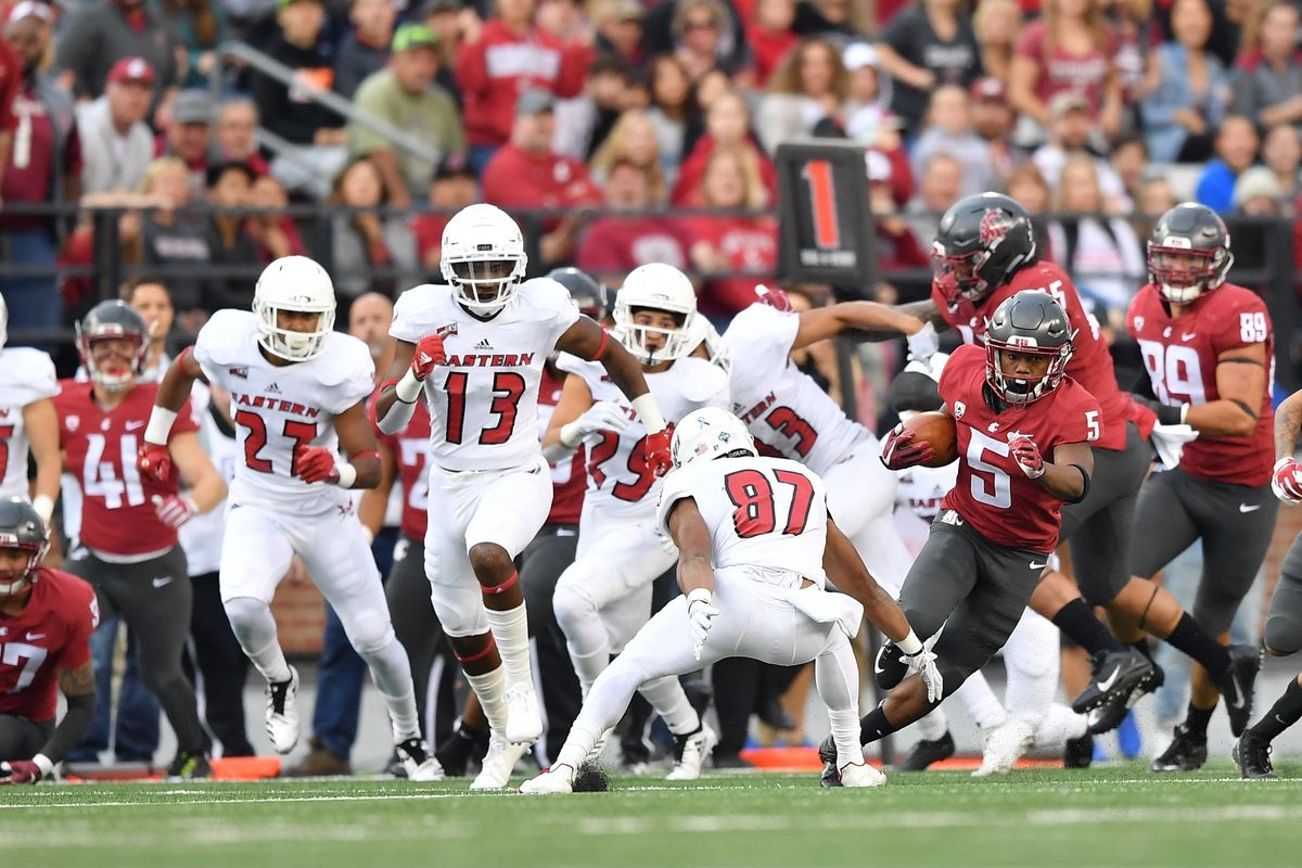Washington State Cougars wide receiver Travell Harris (5) runs the ball for a touchdown on a kickoff return during the first half of a college football game on Saturday, September 15, 2018, at Martin Stadium in Pullman, Wash. (Tyler Tjomsland / The Spokesman-Review)