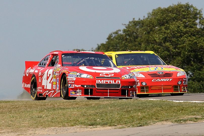 (Left to right) Juan Pablo Montoya and Marcos Ambrose raced each other hard but clean throughout the NASCAR Sprint Cup Series Heluva Good! Sour Cream Dips At The Glen on Sunday in Watkins Glen, N.Y. (Photo courtesy of John Harrelson/Getty Images for NASCAR) (John Harrelson / Getty Images North America)