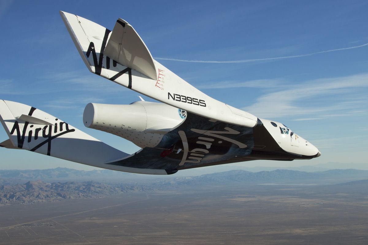 The Virgin Galactic SpaceShipTwo, or VSS Enterprise, glides toward the earth on its first test flight after release from the mother ship, WhiteKnight2, also known as VMS Eve, over the Mojave, Calif., area earlier this month.  (Associated Press)