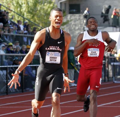 South Carolina's Johnny Dutch, left, reacts after winning the 400-meter hurdles ahead of Washington State's Jeshua Anderson during NCAA Track and Field Championships in Eugene, Ore., Friday. (Don Ryan / Associated Press)