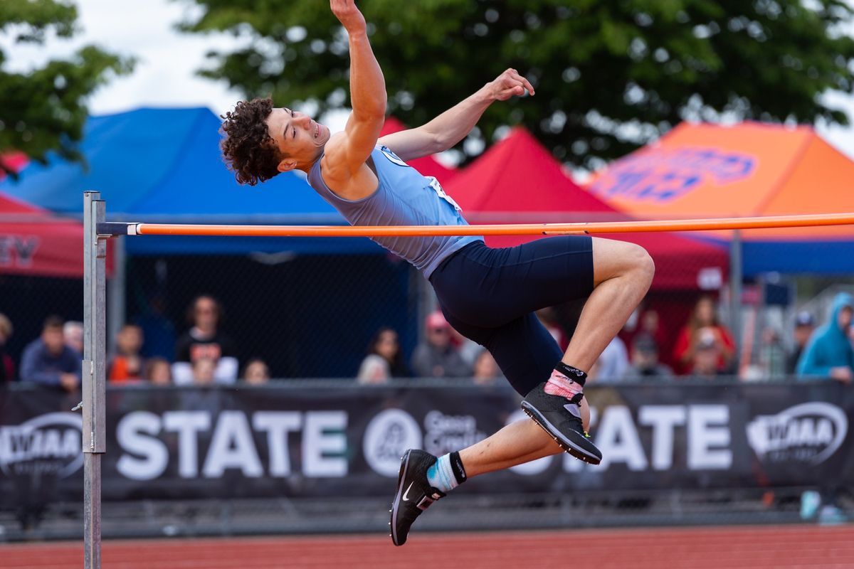 Central Valley’s AJ McGloflin clears the bar in the State 4A boys high jump at Mount Tahoma High School in Tacoma on Friday, winning the event at 6 feet, 10 inches.  (Joshua Hart/For The Spokesman-Review)