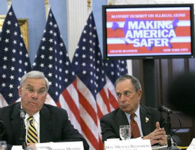 
New York Mayor Michael Bloomberg listens as Boston Mayor Thomas Menino makes opening remarks at a national summit about illegal guns  at Gracie Mansion in New York on Tuesday. 
 (Associated Press / The Spokesman-Review)