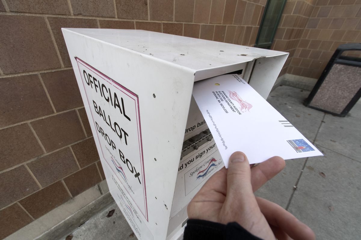 An election ballot is placed in ballot box outside of the Spokane Public Library on Nov. 7, 2016, downtown Spokane. (Colin Mulvany / The Spokesman-Review)