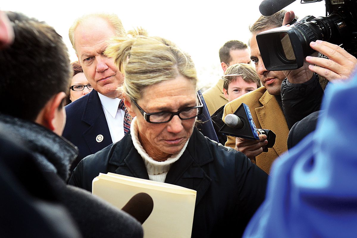 Rita Crundwell walks pass the media outside of the federal courthouse in Rockford, Ill. on Wednesday, Nov. 14, 2012.   Crundwell, the former comptroller of Dixon,  pleaded guilty to allegations she embezzled more than $50 million from the small city in Illinois to fund a lavish lifestyle that included a nationally known horse-breeding operation. She pleaded guilty to a charge of wire fraud and will remain free until her Feb. 14 sentencing hearing. (Alex Paschal / The Telegraph)
