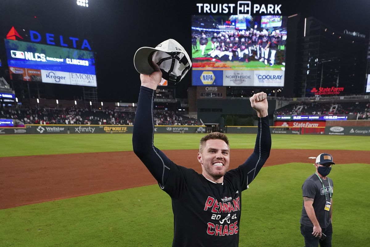 Atlanta Braves Freddie Freeman celebrates after Game 4 of a baseball National League Division Series against the Milwaukee Brewers, Tuesday, Oct. 12, 2021, in Atlanta. The Atlanta Braves won 5-4 to advance to the NLCS.  (John Bazemore)
