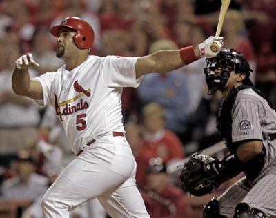 In this May 9, 2006 photo, St. Louis Cardinals Albert Pujols connects for his 17th home run of the season, a three run shot against the Colorado Rockies during their baseball game in St. Louis. (James A. Finley / Associated Press)