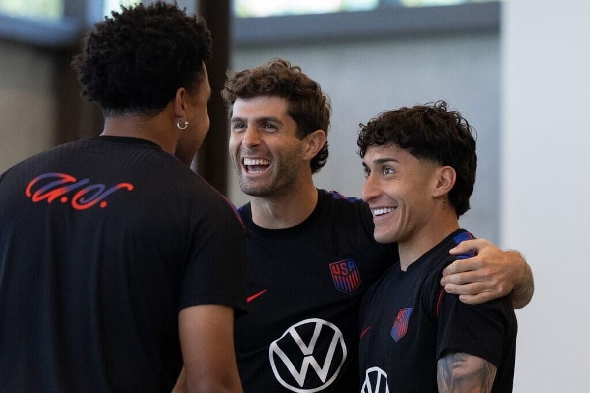 United States captain Christian Pulisic wraps his arm around Alejandro Zendejas during a recent training session. Pulisic, 27, leads a "golden generation" of U.S. players into a home World Cup on Friday against Paraguay. (Getty Images)
