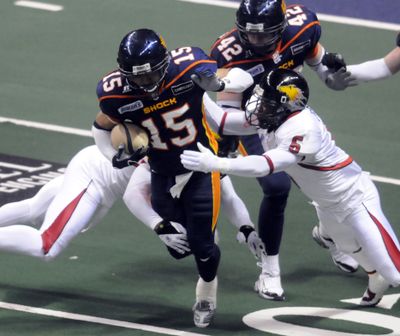 Raul Vijil of the Shock tries to slip through the defense on a kickoff return in the first half of Saturday’s game at the Arena.   (Jesse Tinsley / The Spokesman-Review)