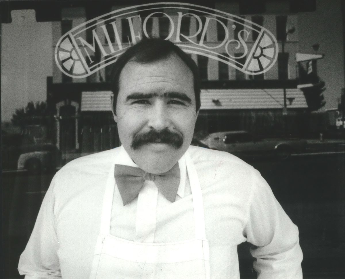 In this 1982 file photo, Jerry Young poses in front of his upscale restaurant, Milford’s Fish House, two years after it opened. (File / The Spokesman-Review)