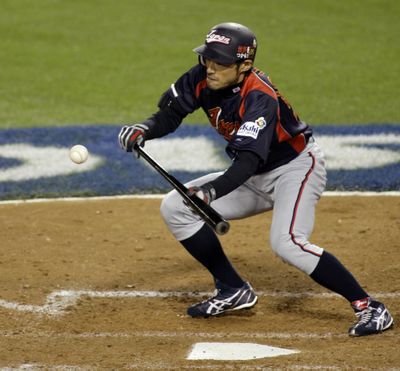 Ichiro Suzuki was 4 for 6 and drove in the winning runs for Japan.    (Associated Press / The Spokesman-Review)