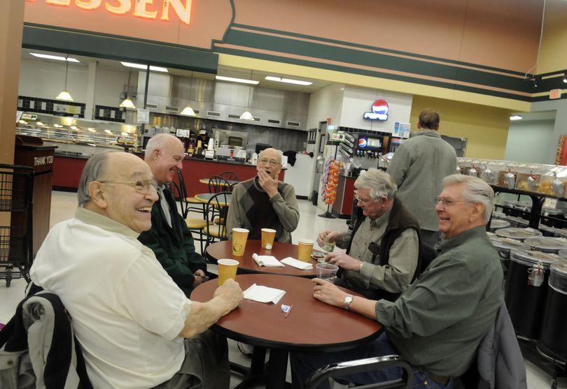 Spokane Valley city councilman and State Sen. Bob McCaslin, left, responds to a question on Tuesday while having coffee with fellow councilman Tom Towey, Jake Mauch, end of table, a man who ask not to be identified and Bill Miller, far right. (J. BART RAYNIAK)