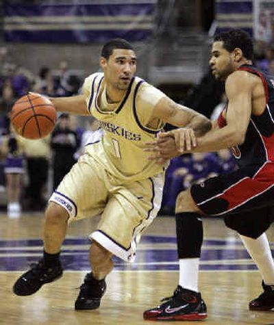 Washington's Tre Simmons, left, had a career-high 23 points in the Huskies' defeat of the San Diego Aztecs.
(Associated Press / The Spokesman-Review)